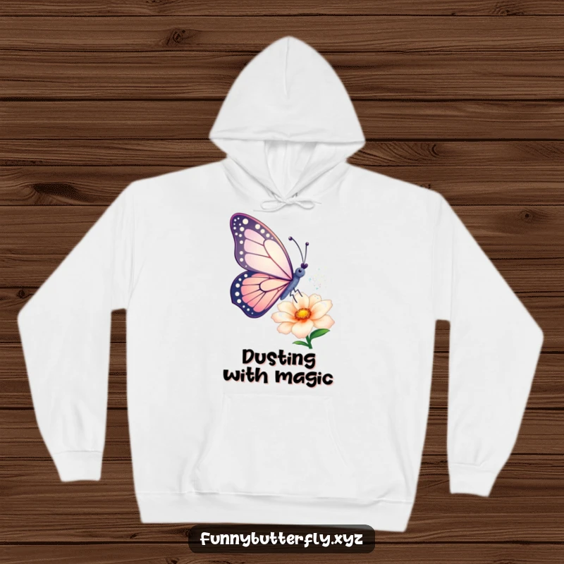 Funny hoodie: A butterfly artistically sprinkles sparkling dust from its wings onto a flower, creating a magical and whimsical scene.