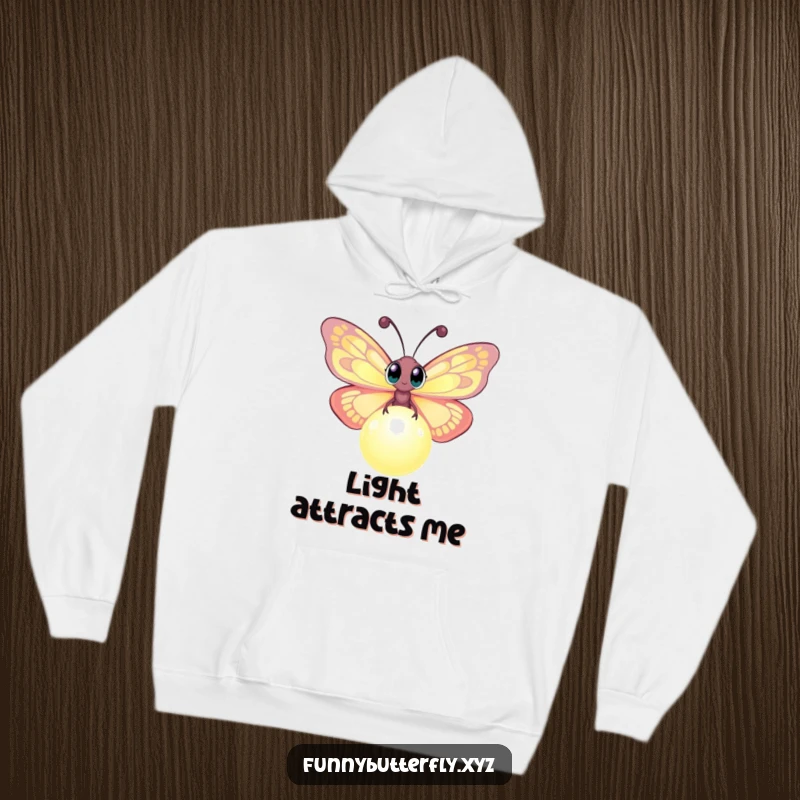 Funny hoodie showcasing a curious butterfly with large eyes investigating a luminous, glowing orb, a cozy and magical design.